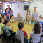Children watch a pottery demonstation by Jon the Potter as part of their pottery birthday party at Eastnor Pottery