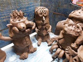 Collaborative clay figures produced by students at King Edward VI Aston School, Birmingham & Eastnor Pottery & The Flying Potter
