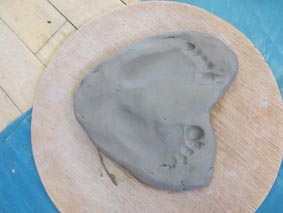 impressions taken from a clay babies pottery session in birmingham led by jon williams from eastnor pottery