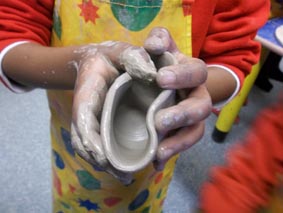 clay pot made on the wheel by a young potter