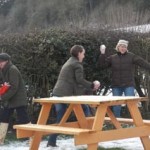 grown-ups enjoy the snow at eastnor pottery herefordshire