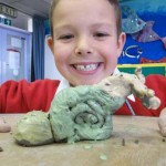 what do you get if you cross a snail with a giraffe and a bag of clay?