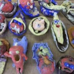 these brightly coloured models were made by young party goers on a childrens pottery party at eastnor pottery herefordshire