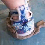 sticky clay stuck to sole of child's shoe at badsey village hall
