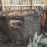 jon the potter helped the children at washwood nursery school to cover their willow round house with a sloppy mixture of clay soil and straw