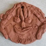 terracotta mum medals made by school children for mothers day