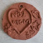 terracotta medals made for mummy for mothers day 0th march 2013 by children at cherry orchard first school in pershore