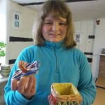 a clay lidded pot fired and glazed made by a child participating on eastnor pottery's children's workshops in the christmas holidays