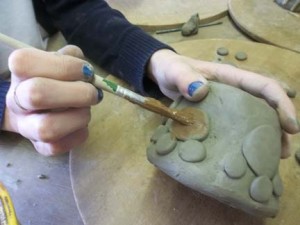 paw print coil pot made by a student from vale of evesham special school on a trip to eastnor pottery herefordshire