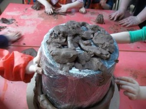 collaborative coil pot in the making at ledbury primary school nursery with jon the potter from eastnor pottery and the flying potter