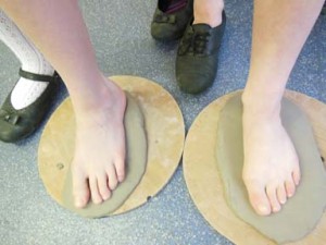 Children's footprints in clay at Castlemorton Primary School in Worcestershire