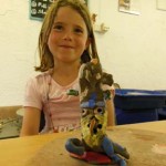 Clay banana made by girl at her pottery birthday party at Eastnor Pottery