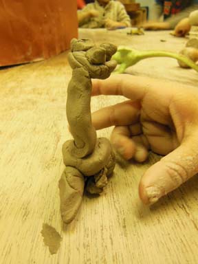 clay dinosaur made by child at Washwood Heath Nursery School