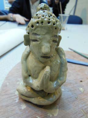 Pottery buddha inspired clay figures made by children at Marlbrook Primary School Hereford