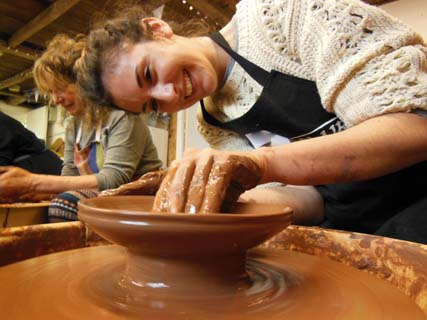 Beginner learning how to make pottery at Eastnor Pottery in Herefordshire