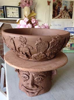 YR1 children from Winterfold House School worked with Jon the Potter from Eastnro Pottery in Herefordshire to make this collaborative clay sculpture based upon the book Handas Surprise