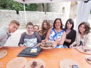 Families of all ages collaborate for giant 150th anniversary tea set