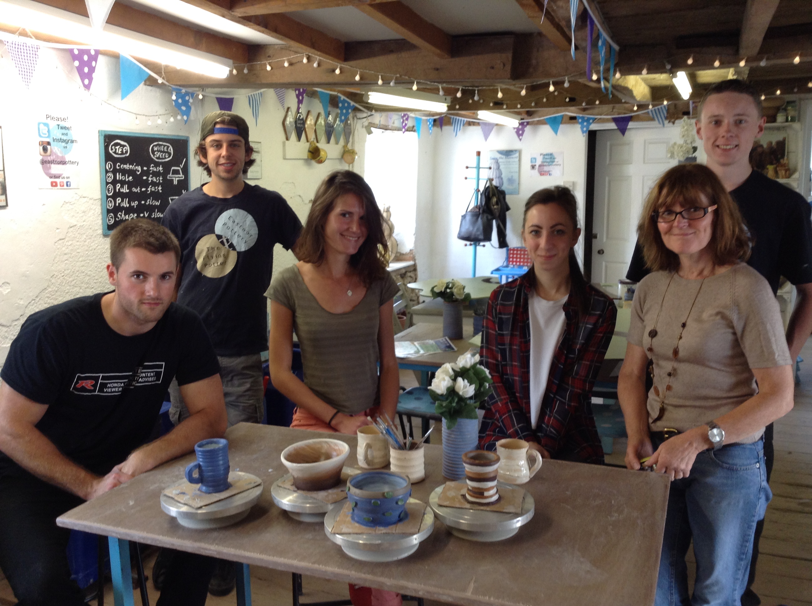 Family group shot plus employees at Eastnor Pottery