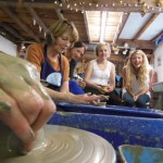 Hens watching the potter's wheel in action