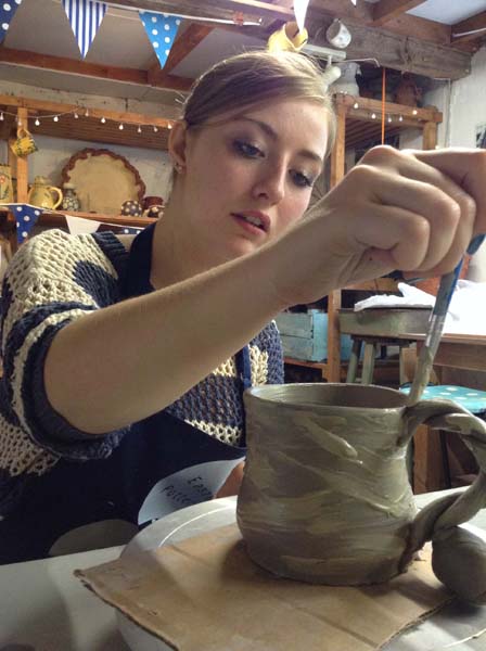 Slip painting on to great mug at Eastnor Pottery