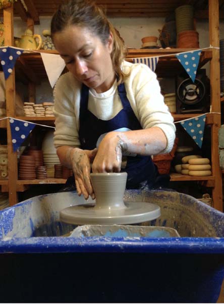 Careful hands on the potter's wheel at Eastnor Pottery