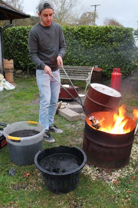 Ethan firing pots in Raku style 