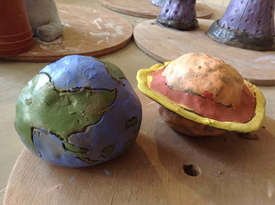 Customers of Eastnor Pottery make Pottery Planets during halfterm break
