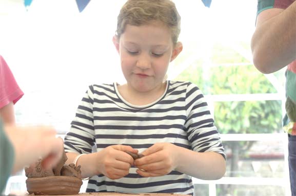 Modelling Owls and Pussycats with Terracotta for birthday party at Eastnor Pottery