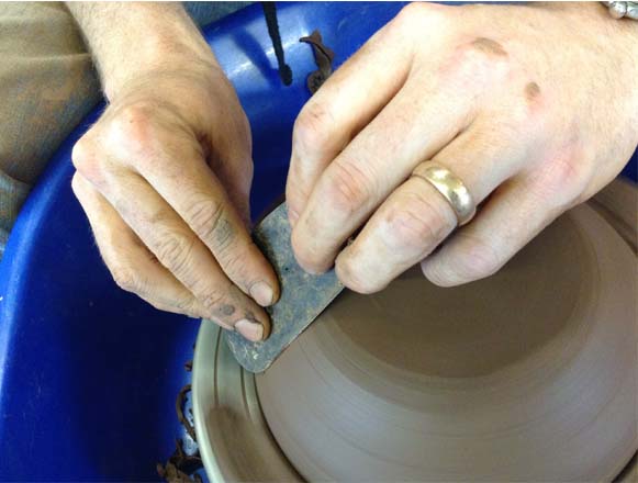 Weekend Workshop participants learning to turn on potter's wheel at Eastnor Pottery
