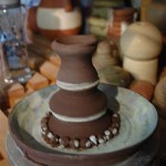 Thrown pots stacked together to make candle holder at Eastnor Pottery