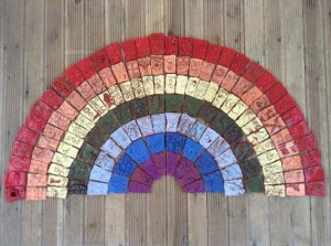 Rainbow tile panel created by students at St Marys Primary School Fownhope Herefordshire