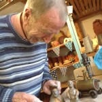 Guest artist Alan puts the finishing touches to his clay figures at Eastnor Pottery