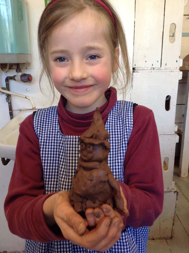 Pupil from Winterfold House School models a clay figure inspired by Julia Donaldson's illustrations