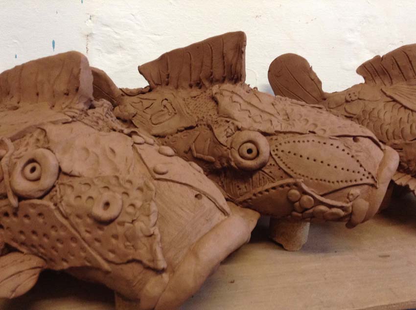 terracotta koi carp made by Regency High School and Eastnor Pottery