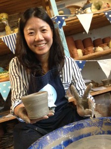 customer making a pot on the potter's wheel at Eastnor Pottery Summer 2017