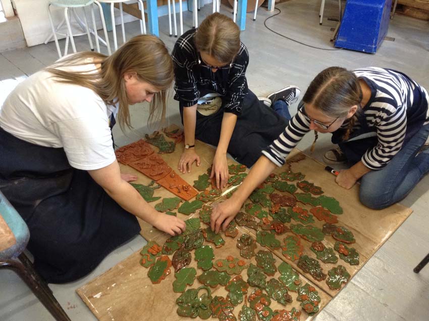 arranging ceramic tiles at eastnor pottery