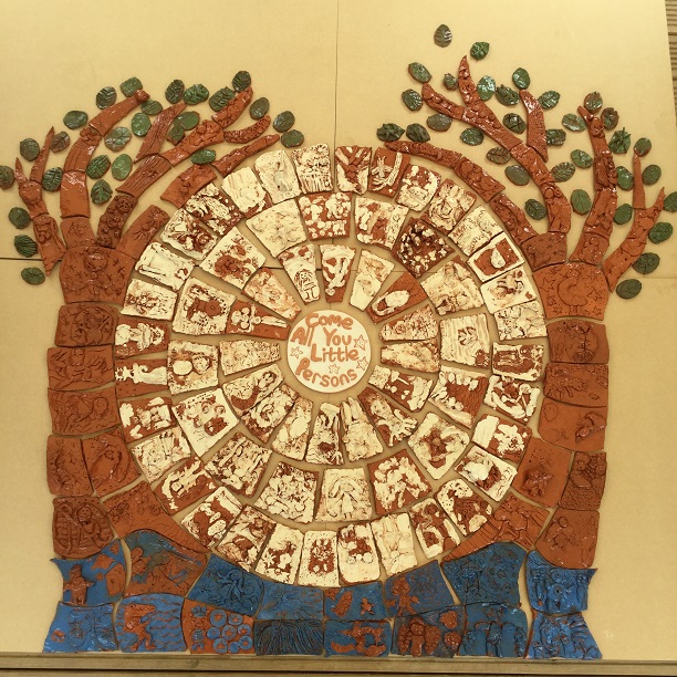 collaborative tile panel made by the flying potter and high meadow infant school based upon come all you little persons
